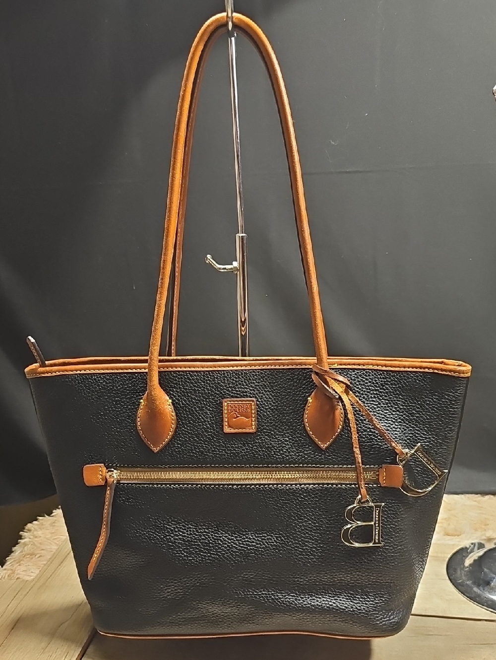 Dooney & Bourke Black Leather Tote with Tan Trim and hanging Dooney and bourke